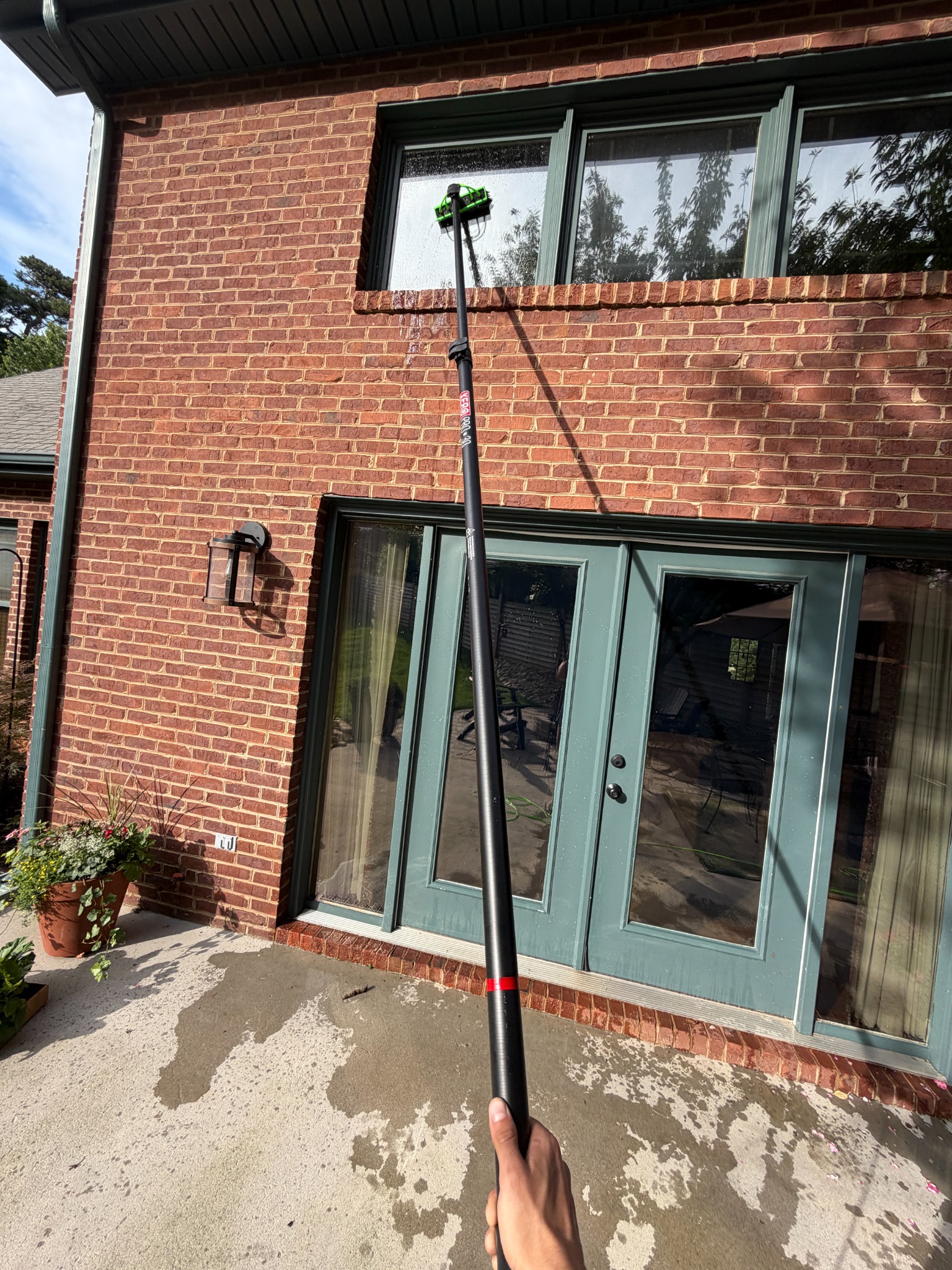 Residential exterior window cleaning with water-fed pole